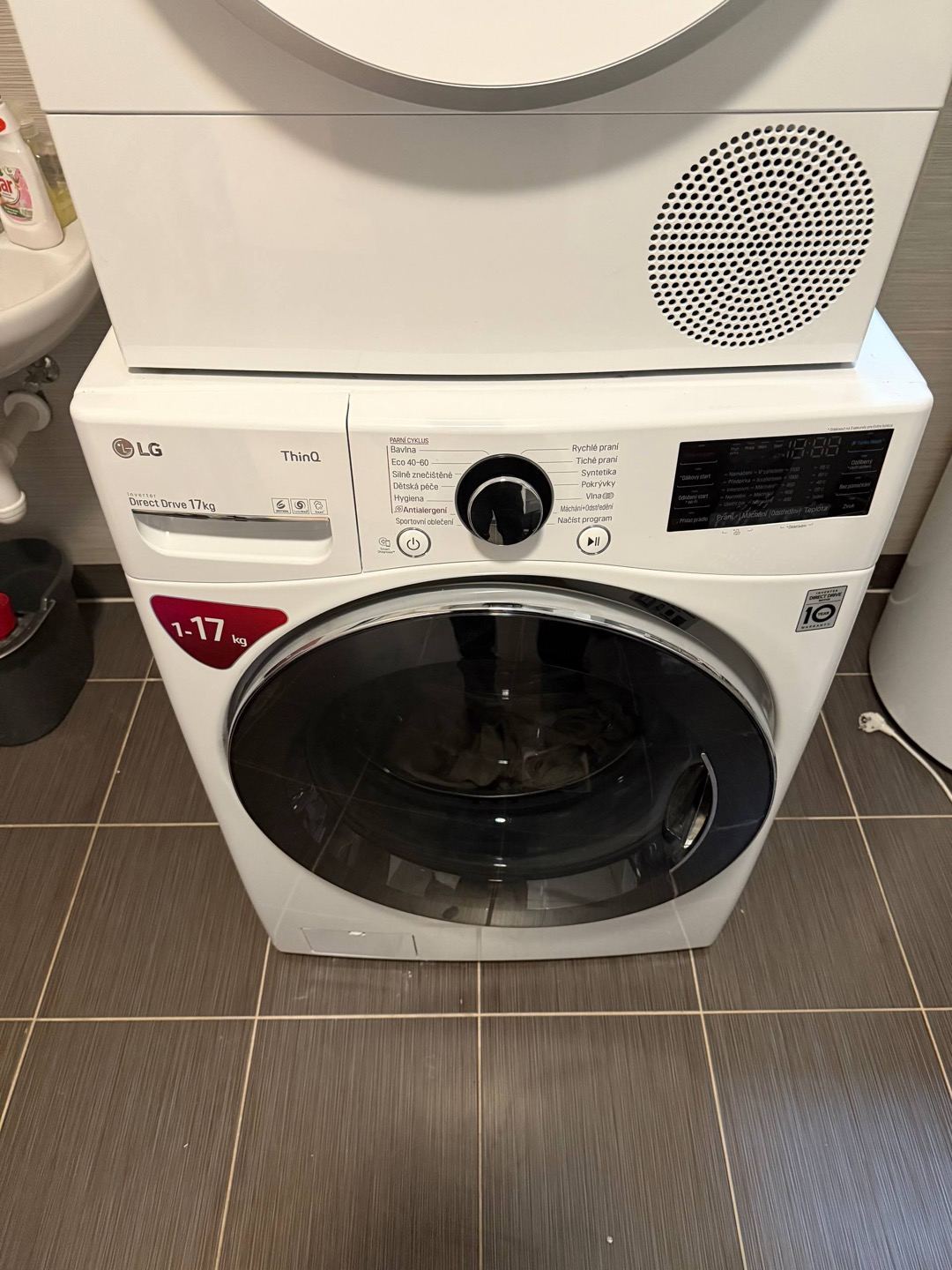 technician repairing a washing machine